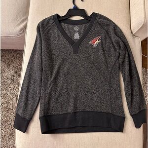 women’s light Arizona Coyotes sweater, an NHL official licensed product.